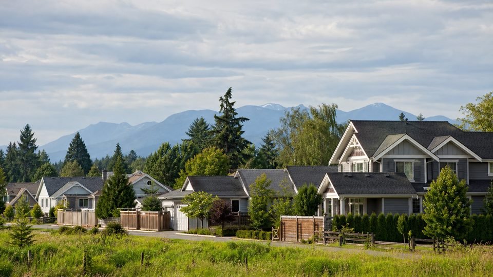 Aldergrove residential edge with Fraser Valley greenery and distant mountains