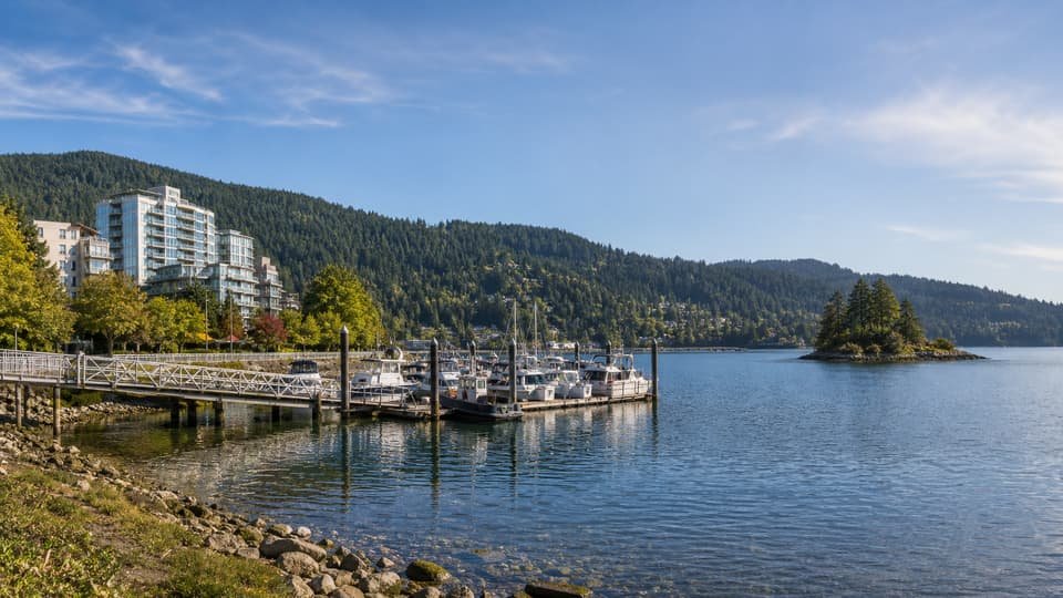 Port Moody inlet waterfront with marina and forested hills